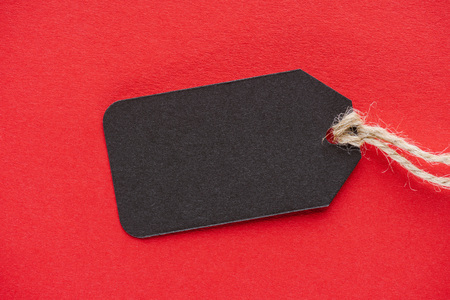 black empty sale tag on red for special offer on black friday