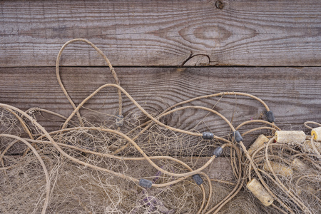 flat lay with fishing net on wooden backgroundの写真素材