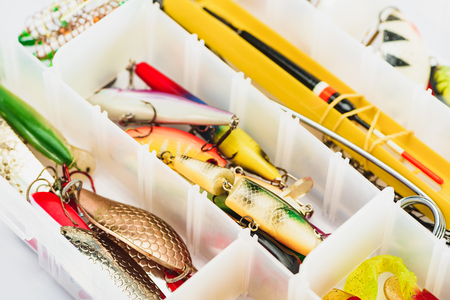 selective focus of fishing tackle and bait in plastic boxの写真素材