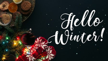 top view of mulled wine in cup, garland and greeting Hello Winter isolated on black, christmas concept