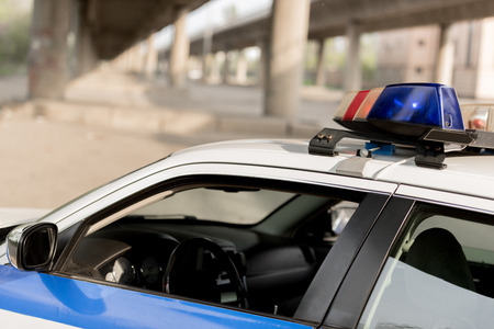 closeup shot of police car with siren on rooftopの写真素材