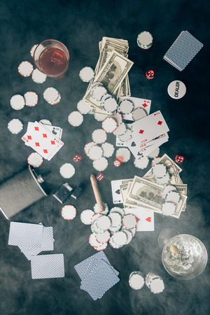 Smoke over chips and money on casino tableの写真素材