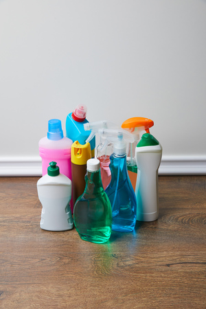 high angle view of domestic supplies for spring cleaning on wooden floorの写真素材