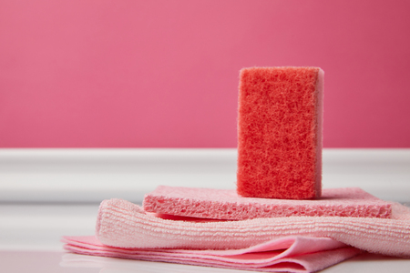 pink washing sponge and rags for spring cleaningの写真素材
