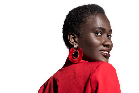 portrait of beautiful young stylish african american woman smiling at camera isolated on white