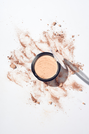 Make up template with face powder on white backgroundの写真素材