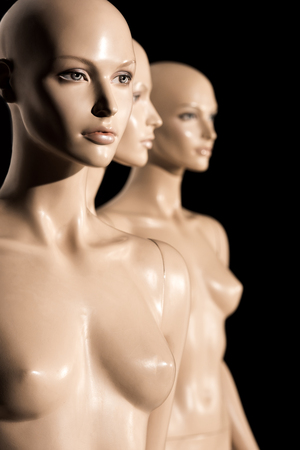 close-up view of naked bald mannequins on black, selective focusの写真素材