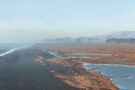 Beautiful Icelandic landscape with wavy ocean and mountains, Vik Dyrholaey, Reynisfjara beach, Icelandの写真素材