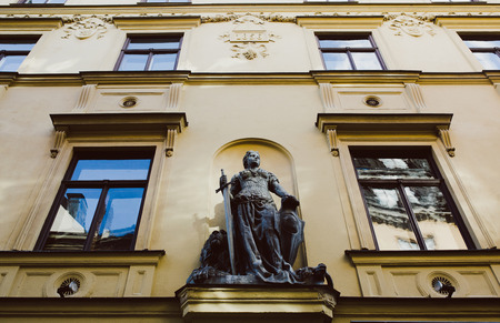 low angle view of statue on beautiful building in stockholm, swedenの写真素材