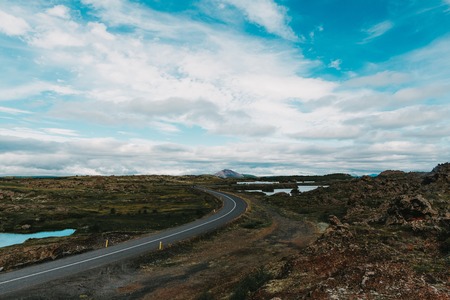 beautiful scenic icelandic landscape and empty asphalt roadの写真素材