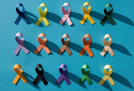 Flat lay with arranged colorful ribbons isolated on blue, world health day conceptの写真素材