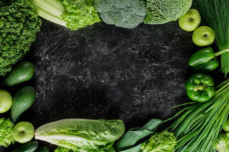 Elevated view of green vegetables on concrete tabletop, healthy eating conceptの写真素材