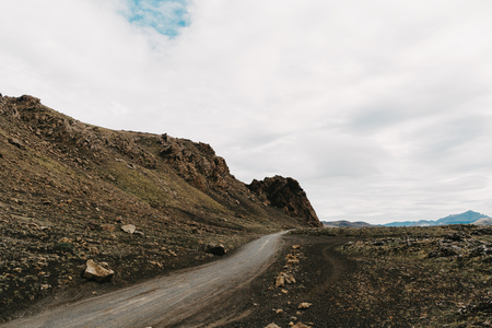 Beautiful Icelandic landscape with rocky hills and empty road, Landmannalaugar, Icelandの写真素材