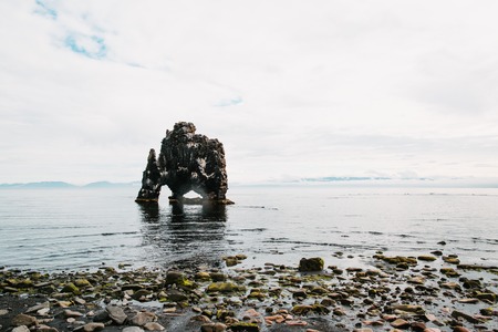 Beautiful rock formation in water near Icelandic seacoast, Hvitserkur, Icelandの写真素材