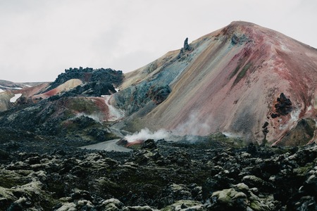 Scenic Icelandic landscape with magnificent rock formations and steam from hot springs, Landmannalaugar, Icelandの写真素材