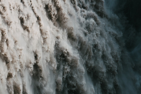Full frame of falling water in majestic powerful Dettifoss waterfall, Icelandの写真素材