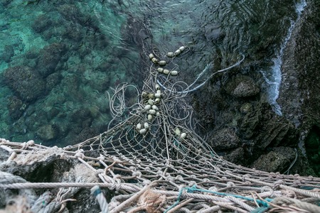 Close up view of fishing net in water, Phi Phi islandsの写真素材