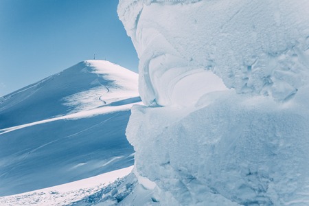 Snow-covered mountain peaks at sunny day in Mayrhofen, Austriaの写真素材