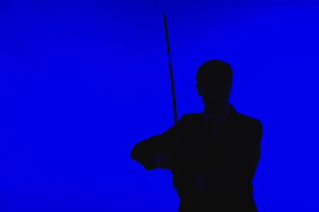Toned picture of silhouette of agent in suit with Katanaの写真素材