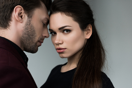 beautiful sensual couple, isolated on greyの写真素材