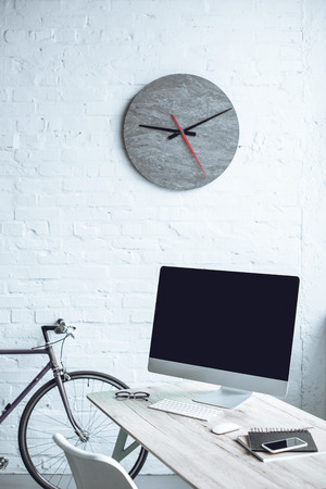 modern workplace with desktop computer and digital devicesの写真素材