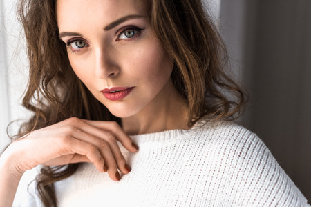 portrait of beautiful tender brunette woman looking at cameraの写真素材