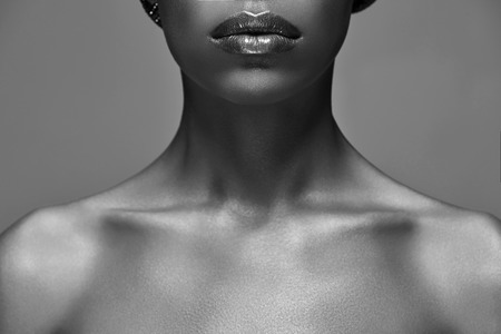 Black and white photo of African American woman isolated on grey backgroundの写真素材