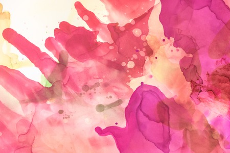 Violet and red splashes of alcohol inks as abstract wallpaperの写真素材