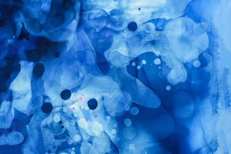 Dark blue splashes of alcohol ink as abstract backgroundの写真素材