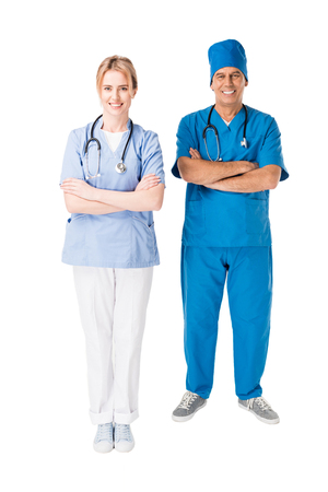 Doctor and nurse with arms folded isolated on white backgroundの写真素材