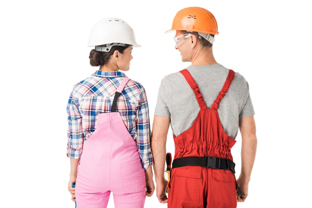 Construction workers team of man and woman in helmets isolated on white backgroundの写真素材