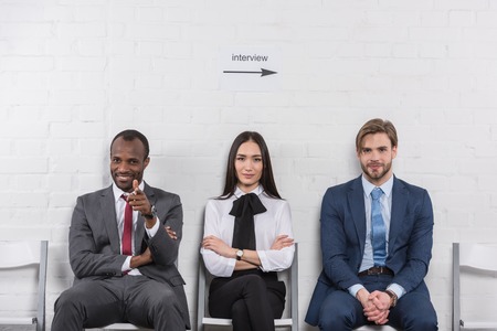 Portrait of smiling multicultural business people waiting for job interviewの写真素材