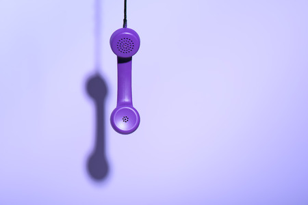 Hanging purple telephone handset, ultra violet trend
