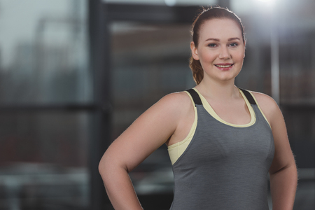 Portrait of obese girl smiling in gymの写真素材