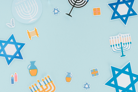Flat lay with hannukah holiday paper signs isolated on blue, hannukah conceptの写真素材