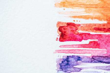 abstract background with colorful watercolor strokes on white paperの写真素材