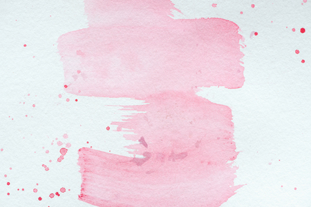 abstract creative texture with pink watercolor strokes and splattersの写真素材