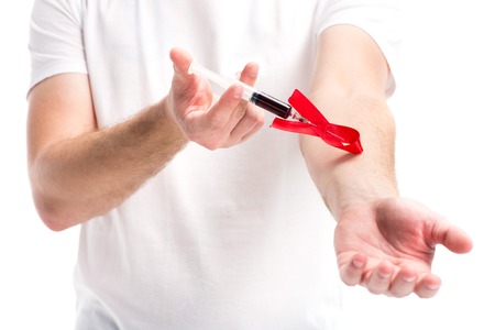 cropped image man making hiv test with syringe isolated on white, world aids day conceptの写真素材