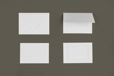 top view of white envelopes and cards isolated on grey