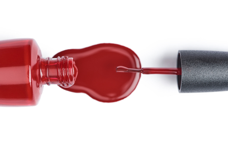 top view of red nail polish isolated on whiteの写真素材