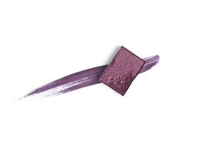 top view of eyeshadow of purple color with stroke on white backgroundの写真素材