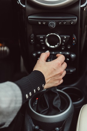 Cropped image of adult woman driving carの写真素材