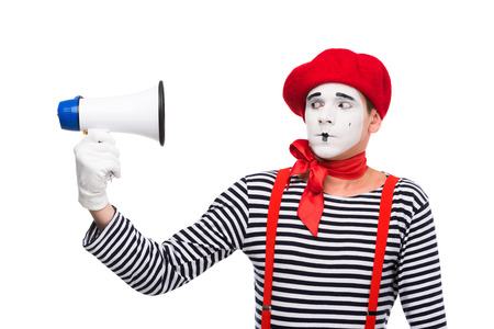 scared mime looking at megaphone isolated on whiteの写真素材