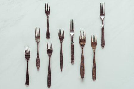 Set of vintage rusted forks on white backgroundの写真素材