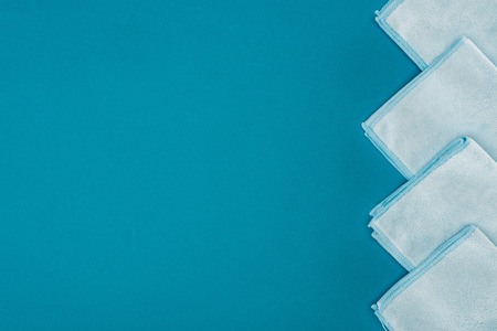 top view of row of blue rags isolated on blueの写真素材
