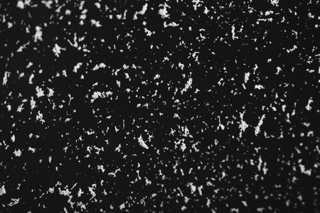 abstract black background with white particlesの写真素材