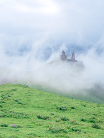 ancient Holy Trinity Church or Tsminda Sameba in beautiful mountains, Georgia