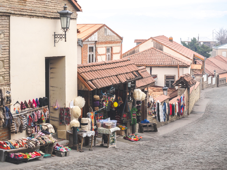 outdoor market with carpets and traditional souvenirs on street in Mestia, Georgiaの写真素材