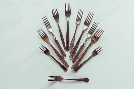 Composition of old metal forks on white backgroundの写真素材