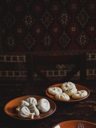 close up view of traditional georgian khinkali on platesの写真素材
